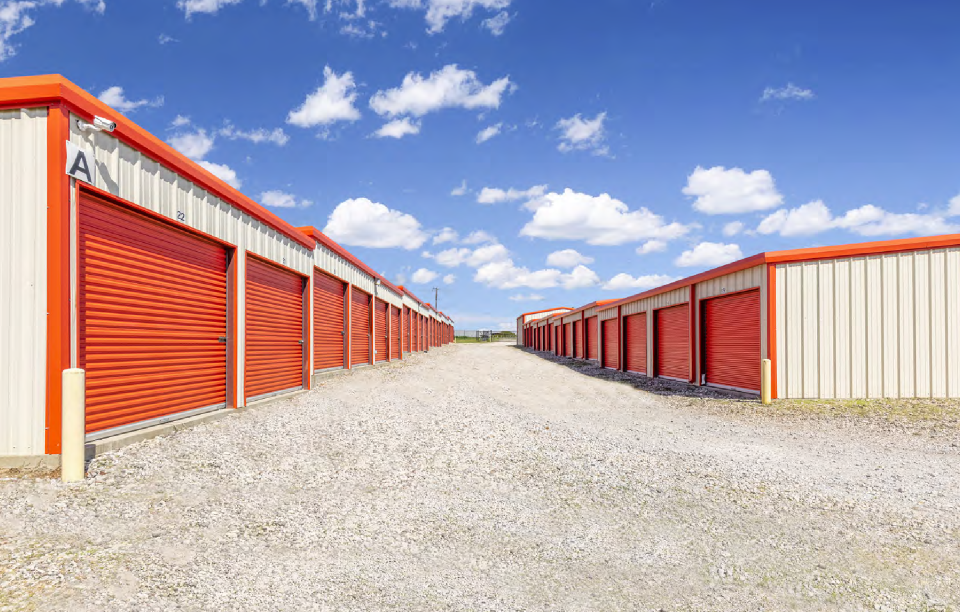 Row of secure drive-up self-storage units at Athens Secure Storage near Malakoff, TX, ideal for holiday décor, furniture, and outdoor gear storage.